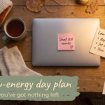 Cosy coffee table with blanket, tea, socks and a low-energy plan card, under the words The low-energy day plan